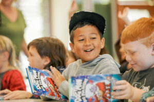 Students read and share the new book, Dog Man: Big Jim Begins